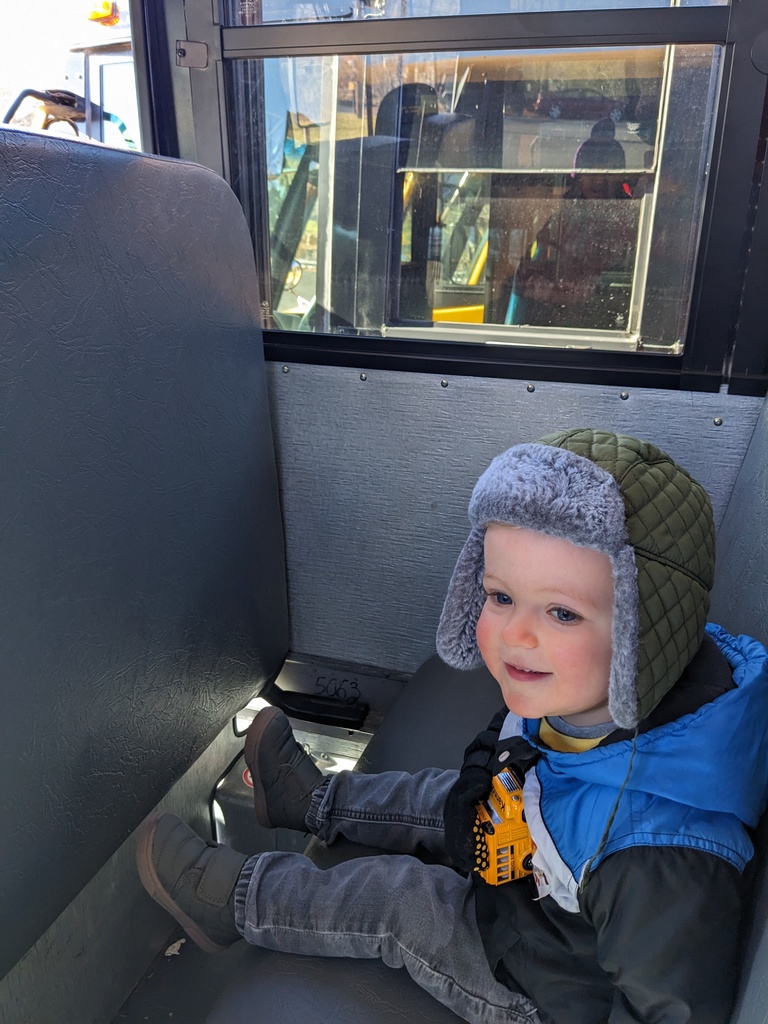 child on bus seat